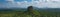 Panoramic shot of the Sigiriya surrounded by forests on a sunny day in Sri Lanka