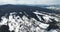 Panoramic shot of a small town in the winter mountains