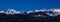 Panoramic shot of the snowy rocky Aravis Range in France