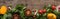 Panoramic shot of spinach, sliced tomatoes, garlic and scattered pepper on wooden table.
