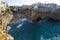 Panoramic shot of the whitewashed coastal town of Polignano a Mare in Apulia, Italy