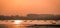 Panoramic silhouette of surat city while sun rising near ONGC bridge