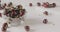 Panoramic slow motion close-up of a sweet ripe red cherry in a glass bowl on a white table and blurred background of