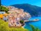 Panoramic of a small and colorful Mediterranean coastal village between the sea and the mountains