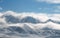 Panoramic snow mountain with white clouds and blue sky