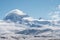 Panoramic snow mountain with white clouds and blue sky