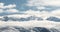 Panoramic snow mountain with white clouds and blue sky