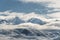 Panoramic snow mountain with white clouds and blue sky