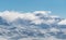 Panoramic snow mountains with white clouds and blue sky