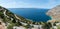 Panoramic summer landscape of Adriatic sea and rocky Dalmatian coast in Croatia, Brac island in distance