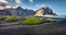 Panoramic summer view of Stokksnes cape with Vestrahorn Batman Mountain on background.