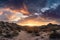 panoramic sunrise over desert landscape, with dramatic clouds and sky