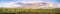 Panoramic sunset landscape of the marshes of south San Francisco bay, Mission Peak covered in sunset colored clouds