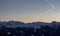 Panoramic sunset view chemtrails Saalbach snowy mountains chemtrail sunset sky from plane