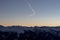 Panoramic sunset view chemtrails Saalbach snowy mountains chemtrail sunset sky from plane