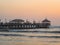 Panoramic sunset view of Huanchaco pier at pacific ocean sea sand beach Trujillo La Libertad Peru South America