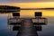 Panoramic sunset view of Jezioro Selmet Wielki lake landscape with recreation pier in Sedki village in Masuria region of Poland