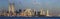 Panoramic sunset view of World Trade Towers, Statue of Liberty, Brooklyn Bridge, and Manhattan, NY skyline