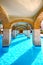 Panoramic swimming pool under bridge in resort