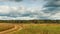 Panoramic timelapse of autumn landscapes, rain clouds fly over field.