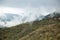 Panoramic top view of Alps mountains in fog and clouds