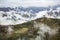 Panoramic top view of Alps mountains in fog and clouds