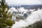 Panoramic top view of Alps mountains in fog and clouds