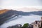 Panoramic top view of Alps mountains in fog and clouds