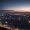 a panoramic urban city skyline aerial view under twilight sky and neon night in ...