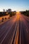 Panoramic urban view of M30 at sunset with red trails of cars in Madrid, Spain