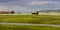 Panoramic view of abandoned barns in the middle of Prairie landscape of Colorado