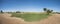 Panoramic view across golf course in landscaped tropical resort