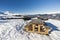 Panoramic view across snow covered slope on alpine mountain with seat