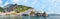 Panoramic view  aerial skyline of small haven of Amalfi village with tiny beach and colorful houses located on rock. Tops of