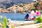 Panoramic view, aerial skyline of small haven of Symi island. Village with tiny beach, moored boats and colorful houses