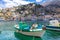 Panoramic view, aerial skyline of small haven of Symi island. Village with tiny beach, moored boats and colorful houses