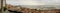 Panoramic view of the Alfama neighbourhood and Tagus river in Lisbon, with red rooftops and a cruise ship