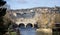 Panoramic view along the River Avon to Pulteney Bridge and weir in Bath, Somerset, UK