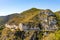 Panoramic view of Alpes rocky coastline with Avenue Bella Vista route at Mediterranean Sea seen from town of Eze in France