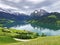 Panoramic view of the Alpine lake Wagitalersee Waegitalersee, the Wagital or Waegital valley, and the peaks Turner and Diethelm