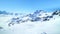 Panoramic view of Alps with skiing slopes, winter snow .