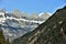 Panoramic view on Alps with steep slope in foreground from tourist path heading directly towards to Murg lakes