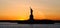 Panoramic view of american icon Statue of Liberty, at sunset
