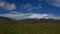 Panoramic view of Antisana volcano in a day with cloudy blue sky. Antisana is a stratovolcano