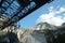 Panoramic view of the Apuan Alps from a quarry of white Carrara marble. A large overhead crane used to move blocks