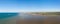 The panoramic view of the artificial port of Gold beach on the sandy beach of Asnelles in Europe, France, Normandy, Arromanches