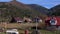 Panoramic view of the Autumn Carpathian Mountains, Cottage Houses on a Sunny Day