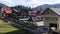 Panoramic view of the Autumn Carpathian Mountains, Cottage Houses on a Sunny Day