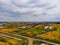 Panoramic view of autumn fields and river, cloudy sky. Russian village