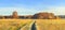 Panoramic view on autumn nature landscape on sunny day. Yellow and red trees on meadow and blue clear sky. Amazing rural scene